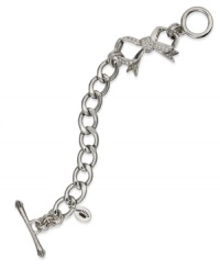 Juicy Couture's darling toggle bracelet shines with pave stones and adorable bow charms. Chain crafted in stainless steel. Charms and closure crafted in silver tone brass. Approximate length: 7-1/2 inches. Approximate drop: 1-1/2 inches. Juicy Couture's darling toggle bracelet shines with pave stones and adorable bow charms. Chain crafted in stainless steel. Charms and closure crafted in silver tone brass. Approximate length: 7-1/2 inches. Approximate drop: 1-1/2 inches.