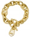 Add a touch of designer to your style. Michael Kors MK logo lock bracelet features a gold tone mixed metal setting with a trendy toggle clasp. Approximate length: 8 inches.