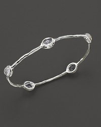 From the Silver collection, five clear quartz stations on a hammered bangle in sterling silver. Designed by Ippolita. From the Silver collection, five clear quartz stations on a hammered bangle in sterling silver. Designed by Ippolita.