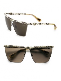 A modified square style in sleek metal accented in luxurious snakeskin-print leather and glittering Swarovski crystals. Available in silver/black with smoke gradient lens. Snakeskin-print leather temples and brow barSwarovski crystals100% UV protectionMade in Italy A modified square style in sleek metal accented in luxurious snakeskin-print leather and glittering Swarovski crystals. Available in silver/black with smoke gradient lens. Snakeskin-print leather temples and brow barSwarovski crystals100% UV protectionMade in Italy