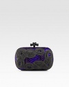 The beautiful Italian quality and craftsmanship of this brand is evident in this knotted rope accented python design.Top clasp closureSuede lining7½W X 4½H X 1½DMade in Italy