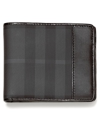 The classic check pattern on the exterior of this bi-fold wallet is a constant reminder of your taste for the finer things in life. The classic check pattern on the exterior of this bi-fold wallet is a constant reminder of your taste for the finer things in life.