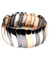 This striped mixed metal stretch bracelet by Nine West has a sliver of shine for everyone. It features silver, rose gold, and hematite-plated mixed metal. Approximate diameter: 2-1/4 inches.