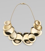 Undulating golden discs on a sensuous snake chain have the sleek, sculptural look of a work of modern art.14k goldplatedLength, about 17Lobster claspImported