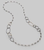 An array of links - ovals and circles, silver and gold, cabled and smooth, large and small - come together in a striking necklace that's the essence of Yurman style. Sterling silver and 18k yellow gold Length, about 37½ Lobster clasp Made in USA