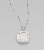 A center, faceted doublet surrounded by dazzling stones on a sleek link chain. Rhodium plated brassCrystalsCubic zirconiaCeramicLength, about 16 to 18 adjustablePendant size, about ½Lobster closureImported 