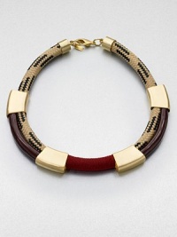 A statement piece in enamel painted rope accented with shiny metal stations and soft suede. Enamel painted ropeBraided ropeBrass-plated metalSuedeLength, about 18Lobster clasp closureMade in USA A statement piece in enamel painted rope accented with shiny metal stations and soft suede. Enamel painted ropeBraided ropeBrass-plated metalSuedeLength, about 18Lobster clasp closureMade in USA