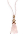 THE LOOKFeminine Metals collectionPink opal-colored beadsRhinestone ball and flower pendantPink opal-colored tassel accent14k goldplated settingNo closure; slip-on styleTHE MEASUREMENTPendant length, about 4Length, about 32ORIGINImported