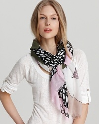 A nature-inspired scarf with earthy tones and leaf print. A nature-inspired scarf with earthy tones and leaf print.
