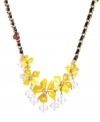 Spruce up your look with sunshine-inspired colors. Betsey Johnson's chic frontal necklace displays yellow resin flowers, clear faceted beads, a ladybug charm and black ribbons. Set in gold-plated mixed metal. Approximate length: 16 inches + 3-inch extender. Approximate drop: 1-1/2 inches.