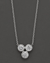 Crafted in 18 Kt. white gold with diamond accents, this pendant necklace is centered on a cluster of 3 gold beads. With Roberto Coin's signature ruby accents.