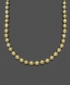 Like drops of gold washed onto the beach, this extraordinary pearl necklace features oval-shaped south sea pearls (10-12 mm) set in 14k gold. Approximate length: 18 inches.