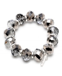 Add subtle sparkle for a cool, overall effect. Kenneth Cole New York bracelet features glass beads in a silver tone mixed metal setting. Bracelet stretches to fit wrist. Approximate length: 7-1/2 inches.