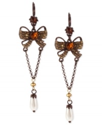 Wrapped up quite nicely. These drop earrings from Betsey Johnson with a bow motif are crafted from mixed metal with topaz and pearl tones enhancing the appeal. Approximate drop: 3-1/4 inches. Wrapped up quite nicely. These drop earrings from Betsey Johnson with a bow motif are crafted from mixed metal with topaz and pearl tones enhancing the appeal. Approximate drop: 3-1/4 inches.