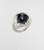 From the Infinity Collection. A deep, dramatic faceted stone of black onyx in a setting formed of intertwining smooth bands and cables of sterling silver.Black onyxSterling silverDiameter, about ½Imported
