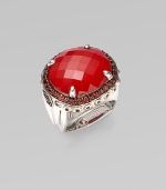 From the Batu Bamboo Collection. A substantial faceted oval of rich red coral sits in a bold bamboo-detailed sterling silver ring, edged by deeply colored pavé garnets. Red coral and garnet Sterling silver Width, about 1 Made in Bali