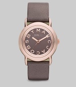 Smart and chic style with leather strap. Quartz movement Water resistant to 5 ATM Round ion-plated rose gold stainless steel case, 33mm (1.3) Gray mirror logo dial Second hand Metallic gray leather strap, 18mm wide (0.7) Imported 