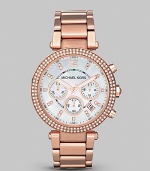 This warm rose gold timepiece shines with a crystal bezel. Quartz movement Water resistant to 5 ATM Round rose goldplated stainless steel case, 39mm (1.5) Crystal bezel Mother-of-pearl dial Arabic numeral and bar hour markers Second hand Rose goldplated stainless steel link bracelet Imported 