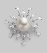 A shiny starburst with lustrous pearl center radiates with glimmering rhinestone rays. 14mm round white pearl Cubic zirconia Sterling silver Diameter, about 1½ Pin backing Made in Spain 