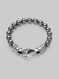 A new look for the modern man, handsomely crafted with a sterling silver raven's head clasp and a string of hematite beads. Sterling silver 10mm hematite beads Lobster clasp closure Bracelet, 9 long Imported A new look for the modern man, handsomely crafted with a sterling silver raven's head clasp and a string of hematite beads. Sterling silver 10mm hematite beads Lobster clasp closure Bracelet, 9 long Imported