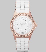 A sleek, understated timepiece with rose goldplated accents and wrapped stainless steel bracelet.Quartz movement Water resistant to 3 ATM Crystal bezel Rose goldplated stainless steel round case, 36.5mm, (1.43) White dial with concave ring Rose goldplated numeral and dot hour markers Second hand Silicon wrapped stainless steel bracelet, 18mm, (.71) Imported 