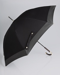 For rainy day style infused with British appeal, take cover under Burberry's luxe logo-printed umbrella. For rainy day style infused with British appeal, take cover under Burberry's luxe logo-printed umbrella.