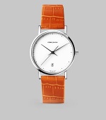 From the Koppel Collection. A vibrant alligator-embossed strap punctuates this sporty yet elegant timepiece.Quartz movement Water-resistant to 3 ATM Stainless steel case, 32mm (1.25) White dial Date display at 6 o'clock Second hand Alligator-embossed calfskin strap Comes with extra black calfskin strap Made in Switzerland