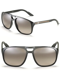 Retro-inspired aviators with double bridge design and classic Gucci logo detail at temples. Retro-inspired aviators with double bridge design and classic Gucci logo detail at temples.
