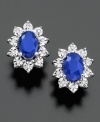 Royalty-inspired studs. Oval-cut sapphires (1-1/3 ct. t.w.) encircled by sparkling diamond accents lends a regal look to these 10k white gold earrings. Approximate diameter: 1/4 inch.