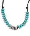 Rich turquoise and silver tones. Fossil's silver tone mixed metal necklace features beads made of both reconstituted turquoise and clear crystal pave. A chocolate leather cord holds everything together with a lobster claw closure. Approximate length: 16 inches + 2 inch extender.