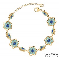 Gorgeous Bracelet by Lucia Costin with Blue, Mint Blue Swarovski Crystals Surrounded by Twisted Lines and Sterling Silver Middle Flowers; 24K Yellow Gold Plated over .925 Sterling Silver; Handmade in USA