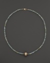 A lustrous champagne cultured freshwater pearl on a sparkling aquamarine necklace from Lara Gold for LTC.