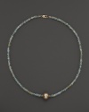 A lustrous champagne cultured freshwater pearl on a sparkling aquamarine necklace from Lara Gold for LTC.