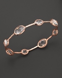 Rose gold, set with clear, faceted quartz stations, is elegant alone--and striking when stacked. By Ippolita. Rose gold, set with clear, faceted quartz stations, is elegant alone--and striking when stacked. By Ippolita.
