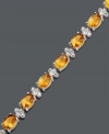 Refresh your look with sun-inspired style. Bracelet features oval-cut citrine (12 ct. t.w.) and sparkling diamond accents set in sterling silver. Approximate length: 7-1/2 inches.