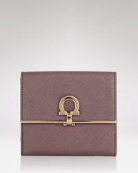 Pulled together perfection starts with practical accessories like this leather wallet from Salvatore Ferragamo. It's a beautiful accompaniment for every look with plenty of pockets to keep the essentials in place. Pulled together perfection starts with practical accessories like this leather wallet from Salvatore Ferragamo. It's a beautiful accompaniment for every look with plenty of pockets to keep the essentials in place.