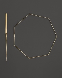Slim, geometric 14K yellow gold hoop earrings by Lana. Slim, geometric 14K yellow gold hoop earrings by Lana.