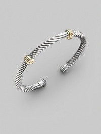 From the Thoroughbred Collection. A signature Yurman sterling silver cable, richly adorned with two textured bands of 14k gold. Sterling silver & 14k yellow gold Cable, 5mm Diameter, about 2¼ Made in USA From the Thoroughbred Collection. A signature Yurman sterling silver cable, richly adorned with two textured bands of 14k gold. Sterling silver & 14k yellow gold Cable, 5mm Diameter, about 2¼ Made in USA