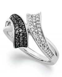 Abstract swirls create the perfect frame. Set in sterling silver, this chic bypass ring is adorned with round-cut black (1/6 ct. t.w.) and white diamonds (1/10 ct. t.w.). Size 7. Abstract swirls create the perfect frame. Set in sterling silver, this chic bypass ring is adorned with round-cut black (1/6 ct. t.w.) and white diamonds (1/10 ct. t.w.). Size 7.