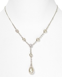 A large pear-shaped pearl pendant makes a elegant finish to this sterling silver necklace with pearl stations from Majorica. A large pear-shaped pearl pendant makes a elegant finish to this sterling silver necklace with pearl stations from Majorica.