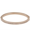 Style meant for stacking. This must-have design by Michael Kors combines a thin, stackable bangle with pave-set glass accents. Set in rose gold tone mixed metal. Approximate diameter: 2-1/2 inches.