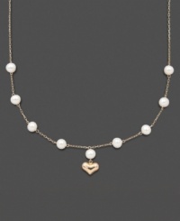 For the little girl who has stolen your heart. This illusion necklace features cultured freshwater pearls (5-6 mm) with a 14k gold dangling heart charm. Set in 14k gold. Approximate length: 13 inches. Approximate drop: 1/2 inch.