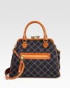 Rich leather pairs beautifully with quilted denim in this lady-like design with a classic kiss-lock closure. Detachable leather shoulder strap, 17½ dropKiss-lock closureOne outside zip pocketOne inside zip pocketTwo inside open pocketsCotton lining12½W X 9H X 1½DMade in Italy