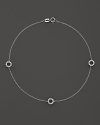 Diamonds sparkle from the circle stations on this dainty 14K white gold ankle bracelet.