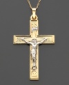 Comforting charm. This crucifix pendant features intricate design and beautiful 14k gold and 14k white gold. Approximate length: 1-1/2 inches. Chain not included.