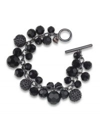Sophisticated style. Black glass beads with glittering charms have an elegant effect on Carolee's cluster bracelet. Crafted in hematite tone mixed metal with a toggle closure, it's an effortless choice for mixing and matching within your wardrobe. Approximate length: 8 inches. Sophisticated style. Black glass beads with glittering charms have an elegant effect on Carolee's cluster bracelet. Crafted in hematite tone mixed metal with a toggle closure, it's an effortless choice for mixing and matching within your wardrobe. Approximate length: 8 inches.