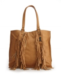 Fabulous in fringe. This head-turning design from Carlos by Carlos Santana features cascading fringe at front panels, brass hardware and a signature charm at handle base. Fabulous in fringe. This head-turning design from Carlos by Carlos Santana features cascading fringe at front panels, brass hardware and a signature charm at handle base.