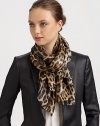 A wildly fashionable leopard print and metallic signature adds unmistakable style to a silk blend scarf.70% silk/30% nylonAbout 70 X 180Dry cleanMade in Italy