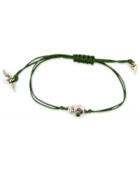 Heavy metal. This RACHEL Rachel Roy bracelet showcases a skull charm with glass stone accents. An adjustable green waxed cotton cord holds it all together. Set in silver tone mixed metal. Approximate diameter: 1/4 inch. Adjustable from 1 inch to 7-1/4 inches. Heavy metal. This RACHEL Rachel Roy bracelet showcases a skull charm with glass stone accents. An adjustable green waxed cotton cord holds it all together. Set in silver tone mixed metal. Approximate diameter: 1/4 inch. Adjustable from 1 inch to 7-1/4 inches.