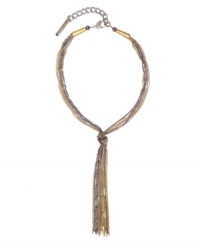 Illuminate a deep V with flair and fringe. You'll stay on-trend in tassels with BCBGeneration's chic, tri tone necklace crafted from silver, gold, and hematite tone mixed metal chains. Approximate length: 16 inches. Approximate drop: 7 inches. Illuminate a deep V with flair and fringe. You'll stay on-trend in tassels with BCBGeneration's chic, tri tone necklace crafted from silver, gold, and hematite tone mixed metal chains. Approximate length: 16 inches. Approximate drop: 7 inches.